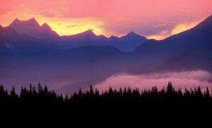 Financial Future Services-peaceful photo of sunset behind the mountains and pine trees Financial Future Services Monument Colorado